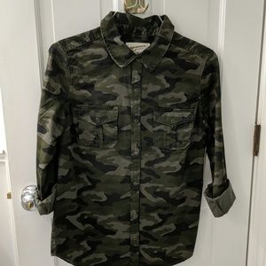 Camouflage snap front shirt.